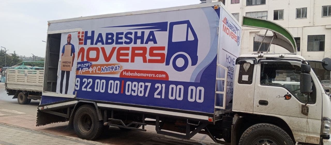 Habesha Movers branded truck parked on a street in Addis Ababa with its rear loading door open